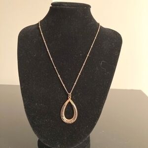 Golden necklace with black beads